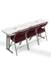 Plastic seminar table with red upholstered folding chairs