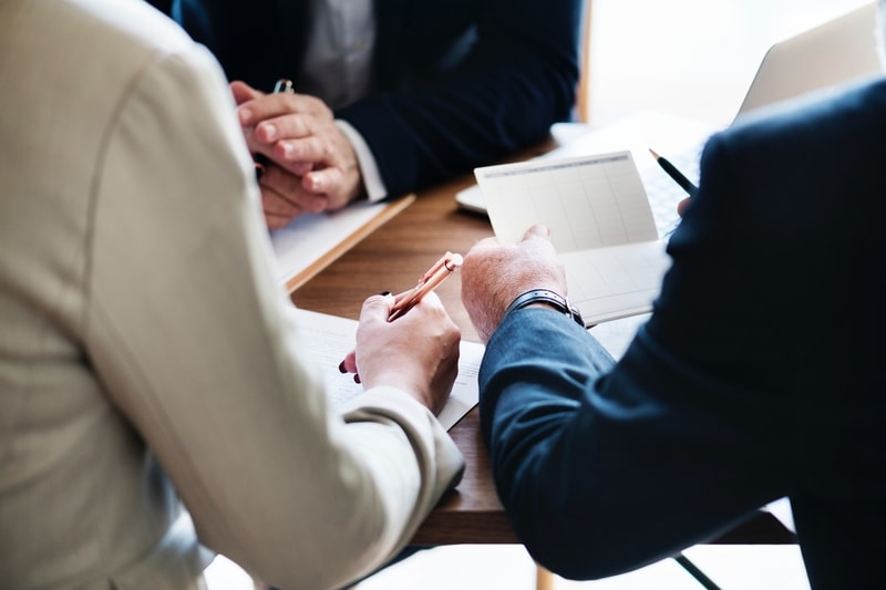 Church leaders discussing financing options for church chairs