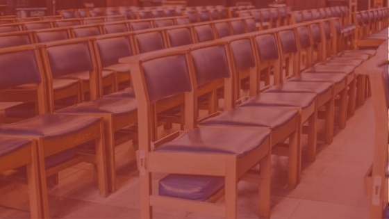 Close-up of church chairs with a red overlay