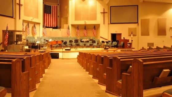 The interior of a church with pews and a choir area