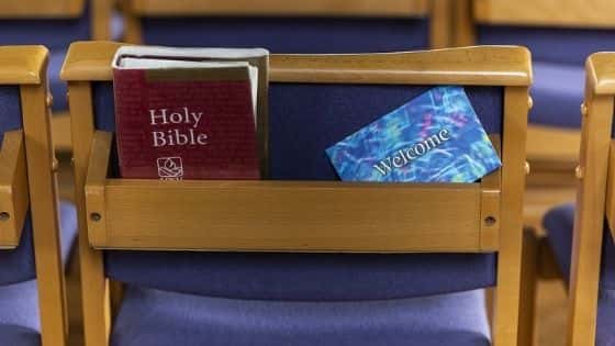 Wooden church chair with purple fabric