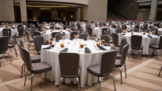 Formal banquet chairs and tables set up at an event venue