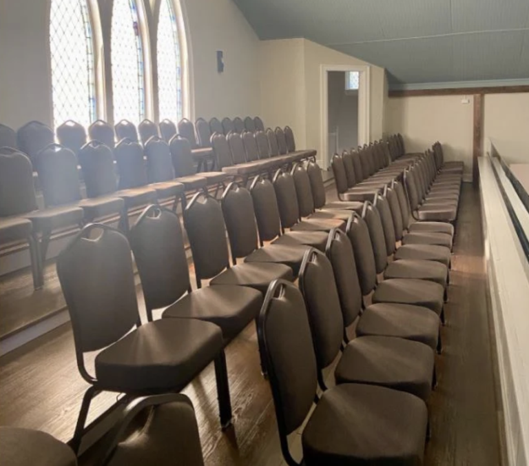 Four rows of church chairs