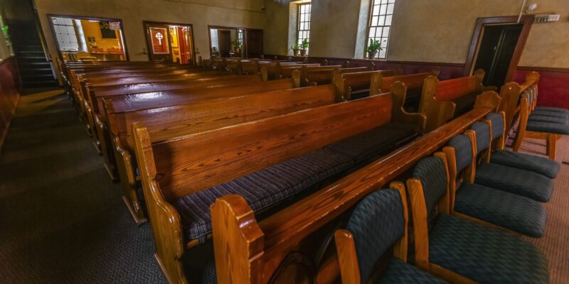 Rows of church furniture set up